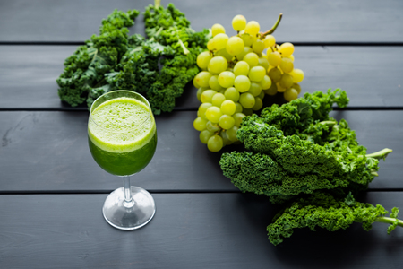 freshly squeezed kale and grape juiceの写真素材