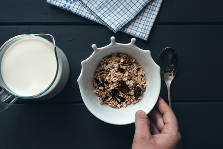 Muesli with milk for breakfastの写真素材