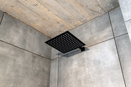 A shower in a minimalist bathroom