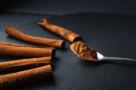 ground cinnamon on a spoonの写真素材