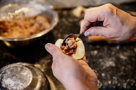 Making homemade dumplings with meatの写真素材