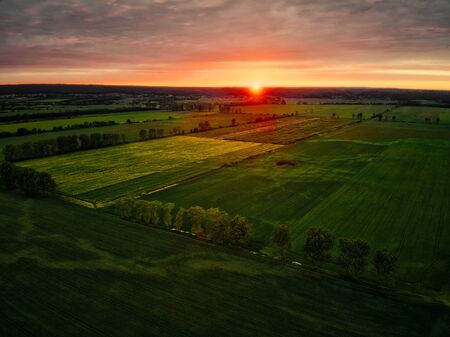 Aerial view of arable fields during sunset