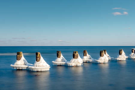 frozen piles on the water