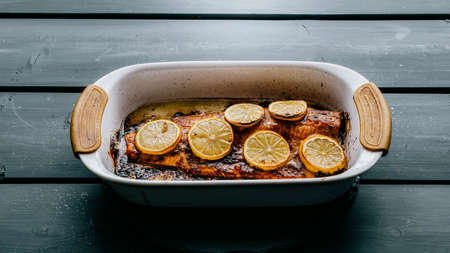 Salmon baked with lemon slices and soyの写真素材