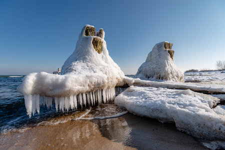 frozen piles on the waterの写真素材