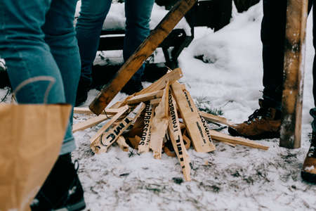 Lighting a fire in the forest in winter