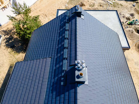 construction of a roof in a single-family house made of ceramic tilesの写真素材