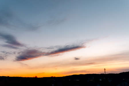 wispy clouds against the sky during sunsetの写真素材
