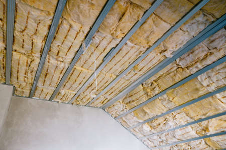 insulation of the attic with glass woolの写真素材