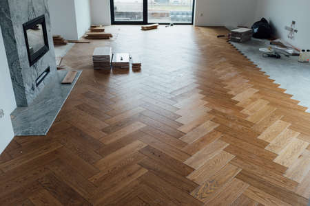 laying herringbone parquet at homeの写真素材