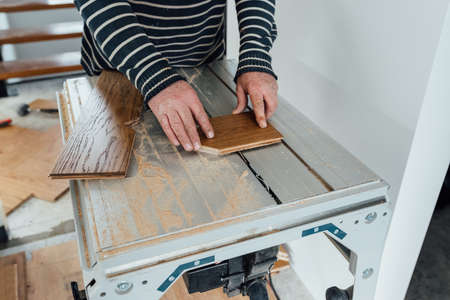 laying herringbone parquet at homeの写真素材