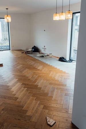 laying herringbone parquet at homeの写真素材