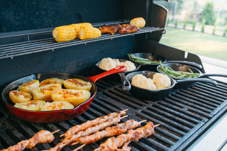 preparing dinner on a gas grillの写真素材