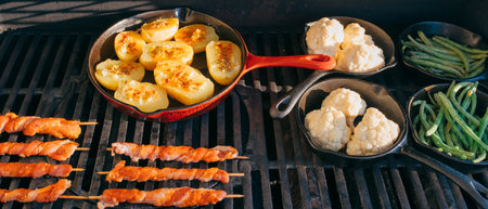preparing dinner on a gas grillの写真素材