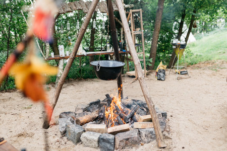cooking food over a fire in a potの写真素材