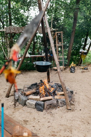 cooking food over a fire in a potの写真素材
