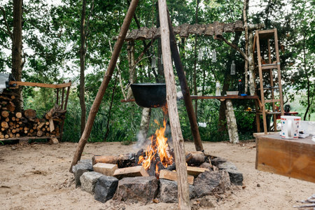 cooking food over a fire in a potの写真素材