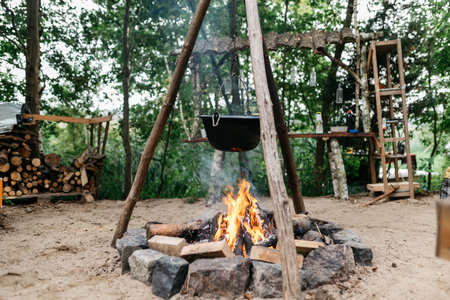cooking food over a fire in a potの写真素材
