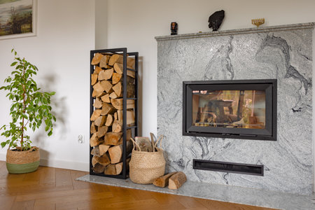 fireplace in a house with a pile of woodの写真素材