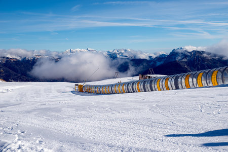 Ski slope in the Swiss Alps on a sunny winter day.の写真素材
