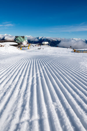 Ski resort in the Alps. Ski slopes covered with fresh snowの写真素材
