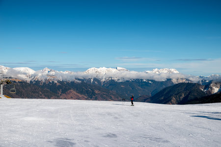 Ski resort in the Alps. Ski lifts and snowboardersの写真素材
