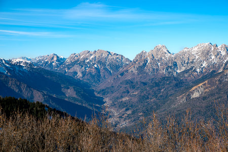 Mountain landscape with snow-capped peaks in the background.の写真素材