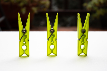 Three ufo green clothespins with the blurred backgroundの写真素材