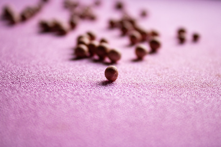 The pink powder in balls with the pink blurred background with the one ball standing in front - Imageの写真素材