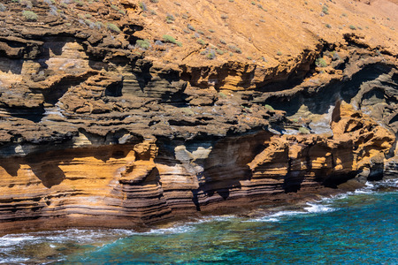 Spectacular orange cliffs and the ocean - Imageの写真素材