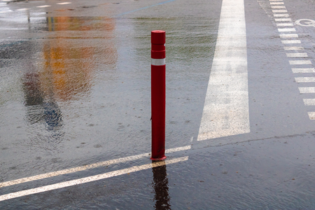 Boundary pillar on the rainy day, red traffic pole  - Imageの写真素材