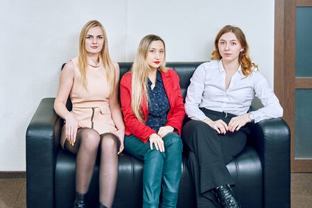 portrait of three women in the office on  sofaの写真素材