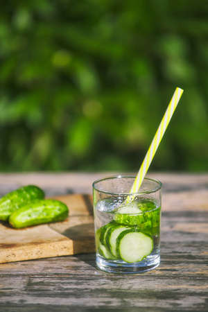 prepared summer cucumber cocktail. natural drinking useful water in nature. summer conceptの写真素材