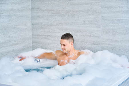 portrait of guy in bubble bath