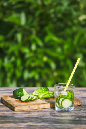 prepared summer cucumber cocktail. natural drinking useful water in nature. summer conceptの写真素材