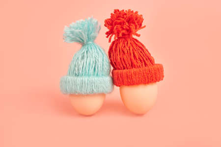 Chicken eggs in knitted do it yourself caps. Concept