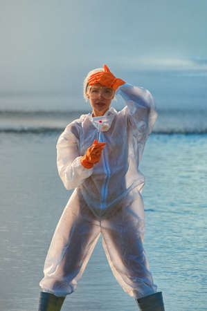 checking the water by a specialist in a protective suit and mask
