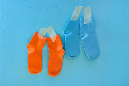 Clean socks drying. Blue backgroundの写真素材