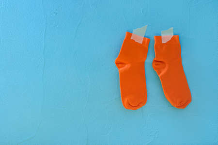 Clean socks drying. Blue backgroundの写真素材