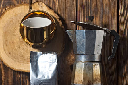 old aluminum teapot coffee maker. wooden backgroundの写真素材