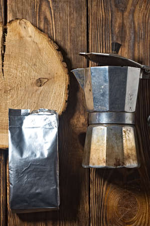 old aluminum teapot coffee maker. wooden backgroundの写真素材