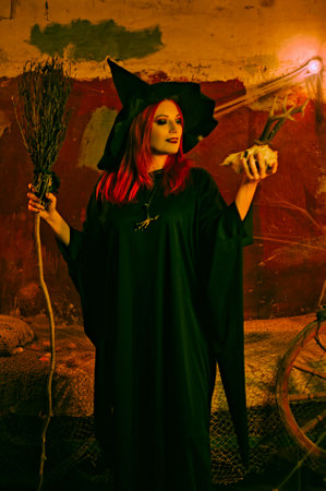 Witch in a red-haired hat. halloween conceptの写真素材