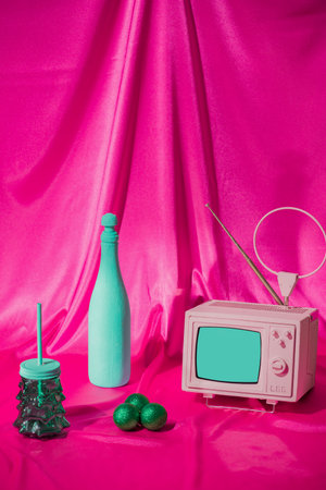 Vintage Christmas decoration. On the table is retro TV and bottle of champagne with glass and...