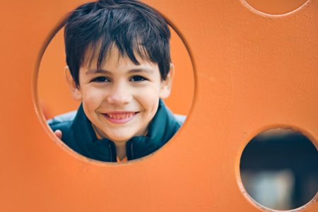 Happy, funny, brave boy on the playground.の写真素材