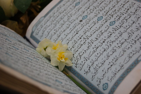 Holy book Koran and the flowersの写真素材