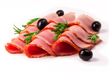 pieces of meat with olives on a white backgroundの写真素材