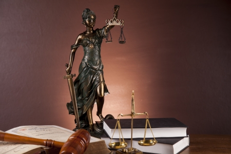 Law concept with wooden table and dark backgroundの写真素材