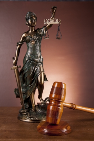 Law and justice stuff on wood table and dark background の写真素材