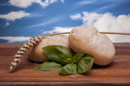 Baking goods and vegetalbes with sky backgroundの写真素材