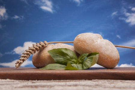 Baking goods and vegetalbes with sky backgroundの写真素材